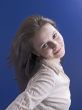 smiling woman on a blue