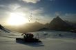 Sunset ski slope snowplow