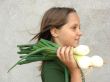 the girl with a green onions