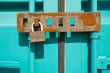 Rusted padlock on freight container closeup