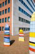 office building with colorful art in front