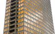 isolated office tower with golden windows