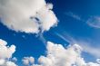 Cloudscape. White clouds in the blue sky.