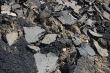 broken asphalt and debris