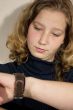 young woman looking at watch