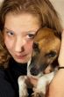 joung woman holding a jack russel