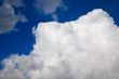 huge white fluffy cloud in a deep blue sky