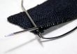 Knitting Black Ribbon With Silver Needles
