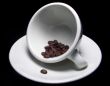 Cup Of Coffee Beans On Saucer