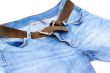 Female jeans with leather belt.