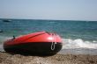 Red boat and seacoast