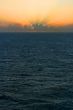 Sunset Over Stormy Sea