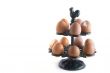 many brown eggs in a rack