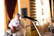 Microphone on tripod with guitarist on background #1