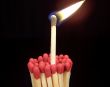 Lit Match Sticking Out of Unlit Matches