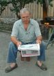 The man reads newspaper