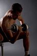 Handsome man doing weights