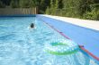 child is swimming with safety-wings