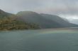 Rainbow, rocky hills and glacier