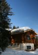 Mountain hut with snow on roof