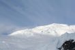 Glaciers and icefalls on snowy mountain peak