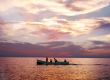 Fishermen on a background of a sunset