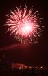 Night celebration fireworks upon dark sky