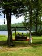 Wooden swing overlooking lake