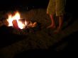 Feet of Man at Beach Side Bonfire