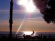 Silhouette of man by the sea at sunset