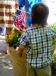 Young Boy Holding British and American Flags