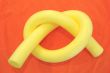 Yellow aqua noodle on orange