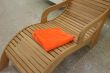 relax chair with orange towel