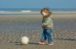cute boy playing soccer