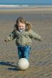 cute boy playing soccer