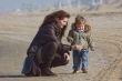 mother and cute boy on the beach