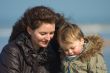 mother and cute boy on the beach