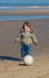 cute little boy playing soccer