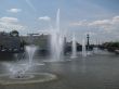 Fountains on the river in summer day