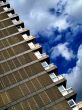 Tower block and cloudy blue sky