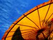 Yellow parasol and blue sky