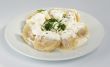 Dumplings with sour cream and greens.