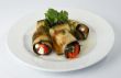 Fried eggplants with tomatoes and cheese.