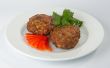 Сutlets with tomato and parsley.