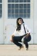 African American Woman in front of Hangar