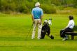senior couple playing golf