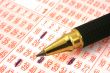 lottery ticket and pen
