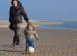 happy mother and her son on the beach