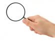 hand with magnifying glass