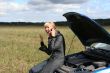 woman with her broken car